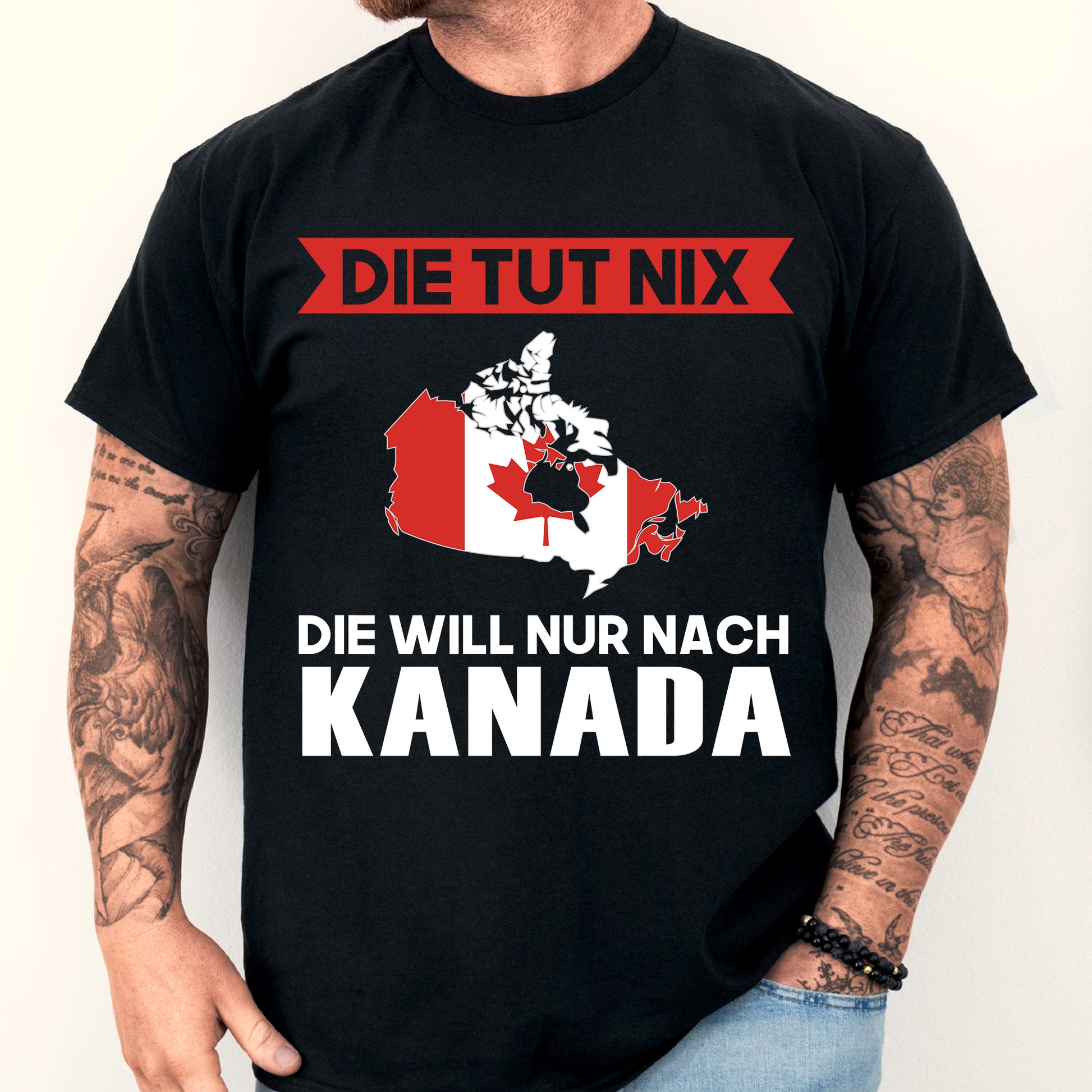 Mann trägt ein T-Shirt mit kanadischer Flagge und dem Text "Die tut nix Geschenk".