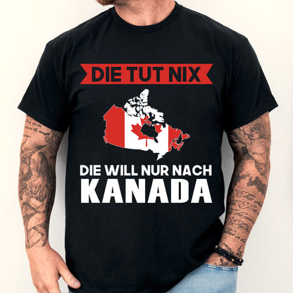 Mann trägt ein T-Shirt mit kanadischer Flagge und dem Text "Die tut nix Geschenk".