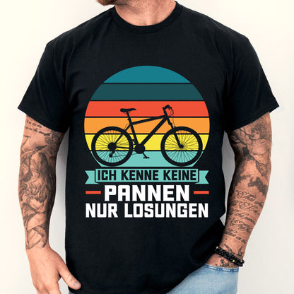 Design eines T-Shirts mit der Aufschrift "Rad Shirt | ich kenne keine Pannen nur Lösungen" und einem stilisierten Fahrradmotiv.